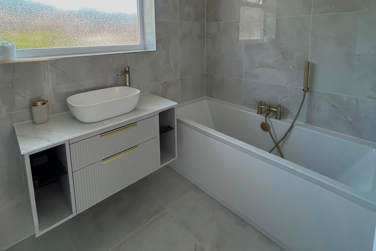 Bathroom fitted out by Avco Maintenance — tiling, plumbing and electrics by one team